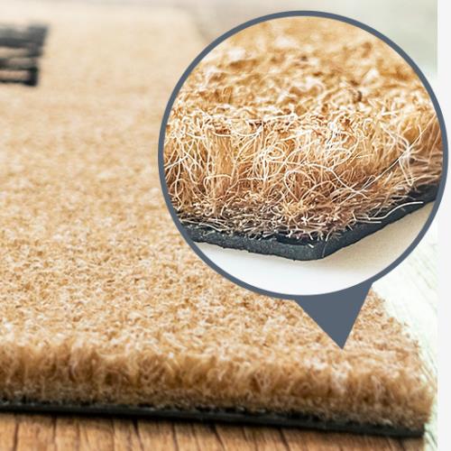 Primer plano de la superficie del tapete de puerta de imitación de palma de coco